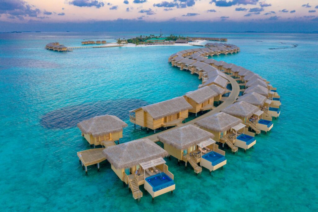 Overwater villas in the Maldives at sunset
